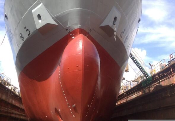 Bow of a large cargo ship in dry dock
