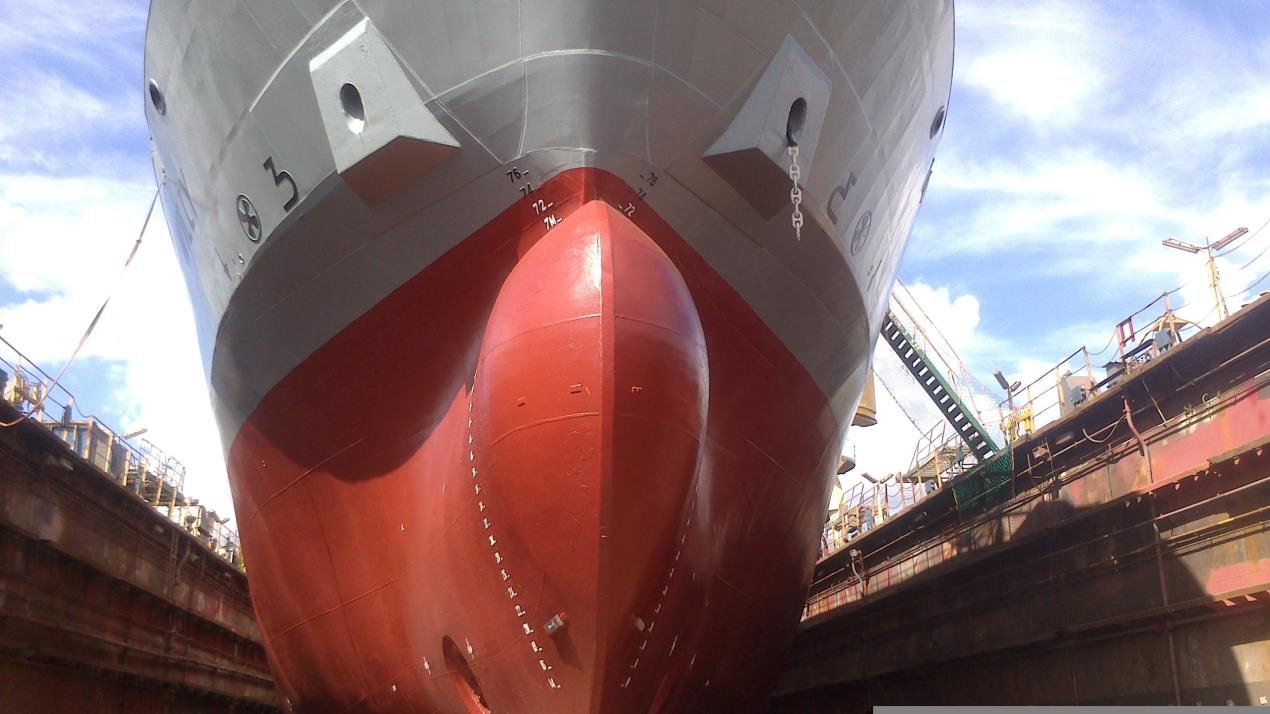 Bow of a large cargo ship in dry dock